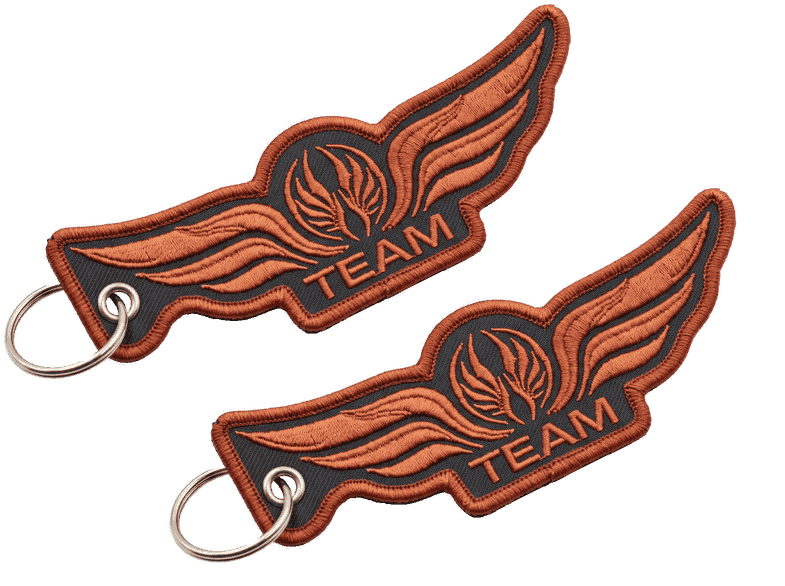 Orange wing-shaped jet tags for keys